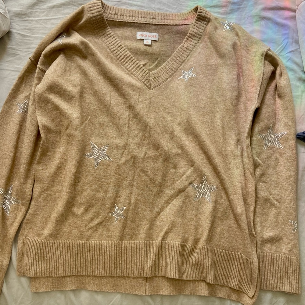 warm sweater with star bedazzlements